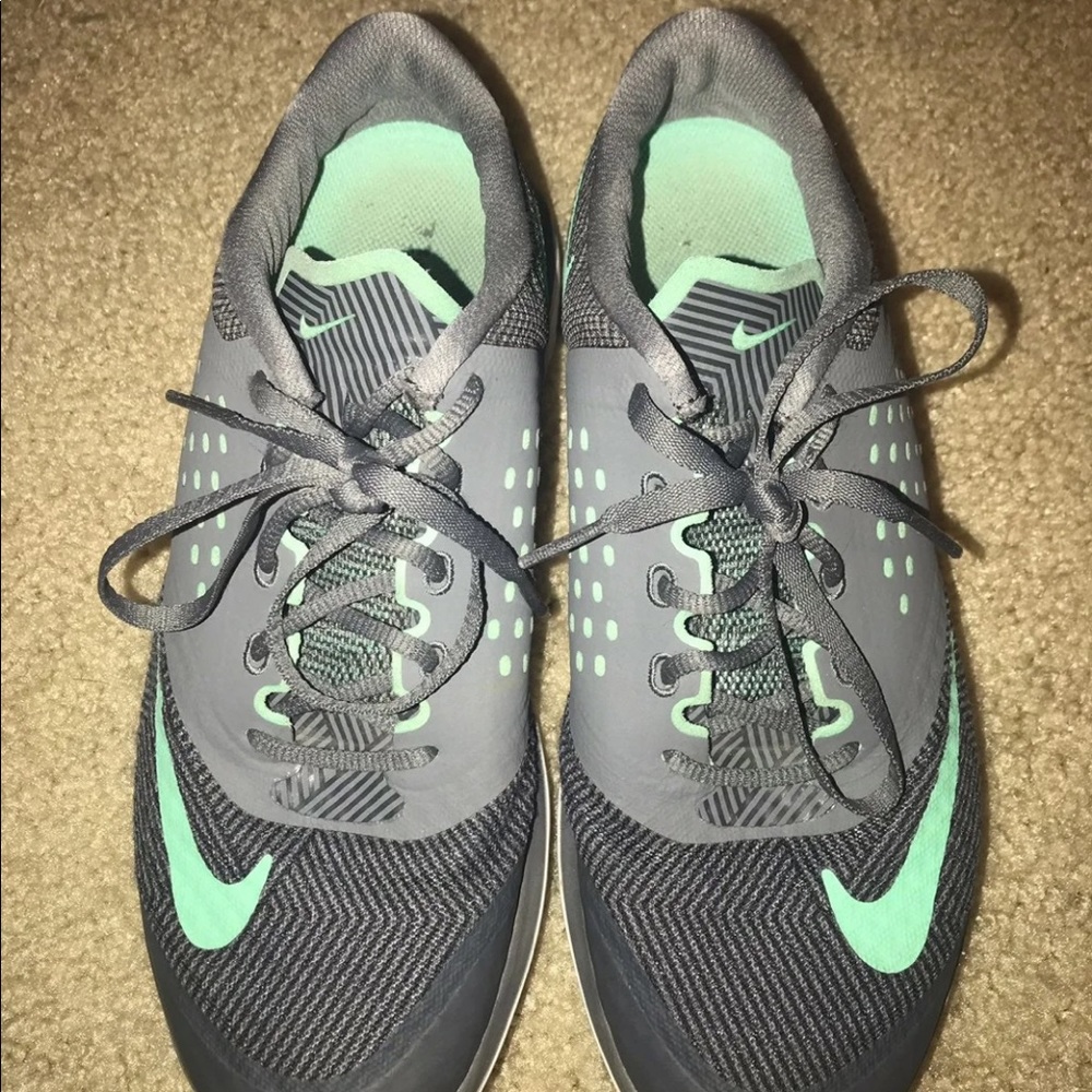 Grey and green Nike running shoes